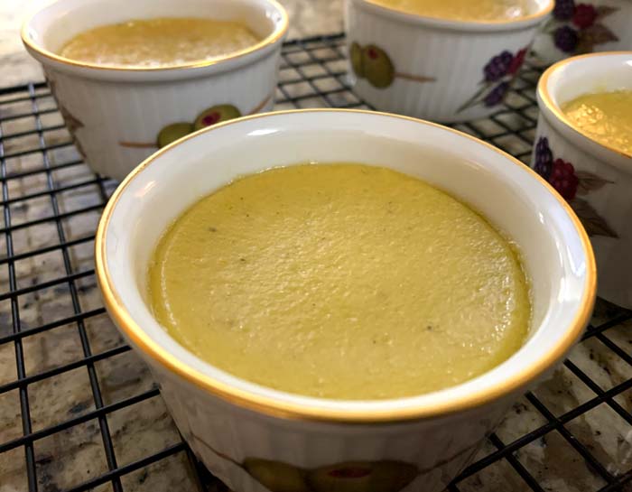 This is what a finished custard looks like in our crème brûlée ramekins. The custard will rise a bit when cooked then sink some after cooling. 