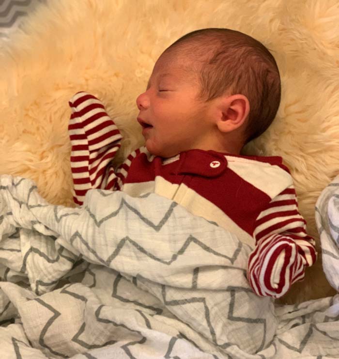 Week 2 baby napping. Unrelated to the topic at hand, but having infant outfits with gloved hands was very helpful since baby would spastically scratch his face from time to time in his sleep.