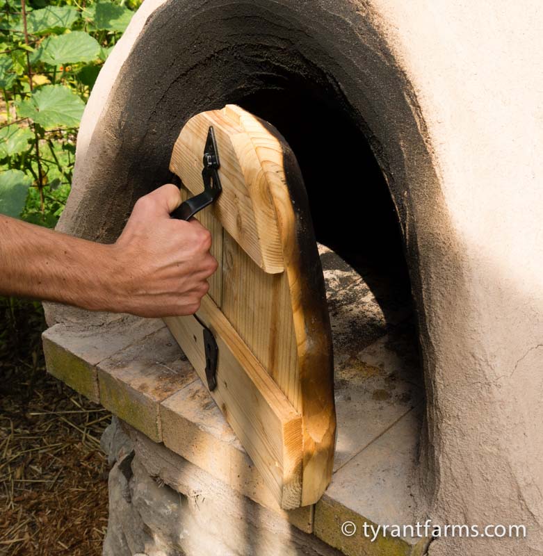 Use UNTREATED wood for your door. Hardwood works best, but pine is fine. You'll want a handle on the door as well to make it easy to put on and take off. Before you cook in your oven, you'll want to soak your door for 6 or more hours so it's fully saturated. This prevents it from burning and also infuses the inside of the oven with steam, which helps give breads and pizza crust an amazing crunchy texture.