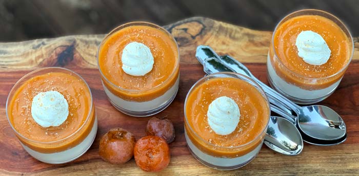 You'll pour your warm panna cotta base into the serving glasses then letting it set in your fridge for 6+ hours before making and adding the top persimmon layer. Clear glasses are the perfect serving dish for this recipe! | American persimmon panna cotta, American persimmon dessert