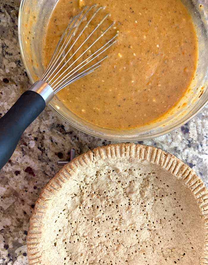 Lightly pre-baked chestnut flour pie crust with fork holes punched in prior to baking to make sure bubbles don't form. Read detailed instructions in recipe below.