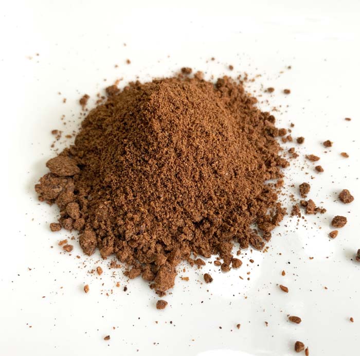 Roasted, ground American persimmon seeds, ready to made into coffee or tea.