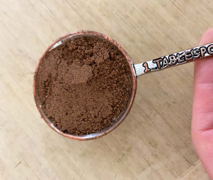 Roasted, ground persimmon seeds are a bit lighter in color than ground coffee.