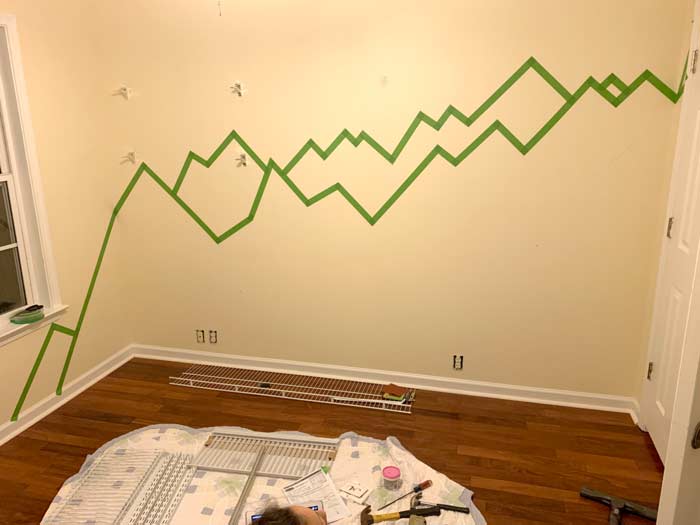 Paint tape outlining the mountains in the baby nursery.