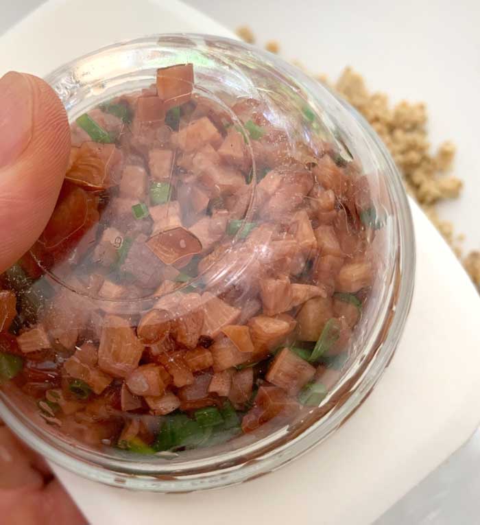 Plating the beefsteak mushroom tartare.
