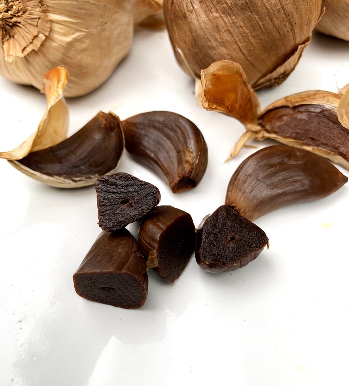 Homegrown hardneck garlic transformed into delicious black garlic in a dehydrator.