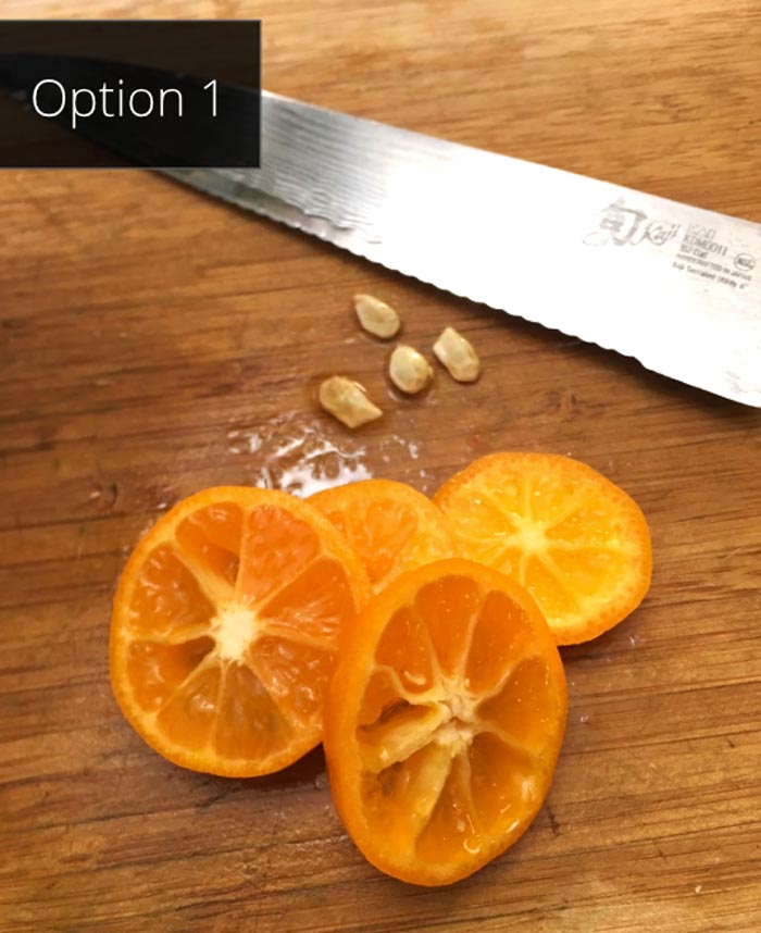 Slicing and de-seeding calamondin oranges to make calamondin marmalade. 