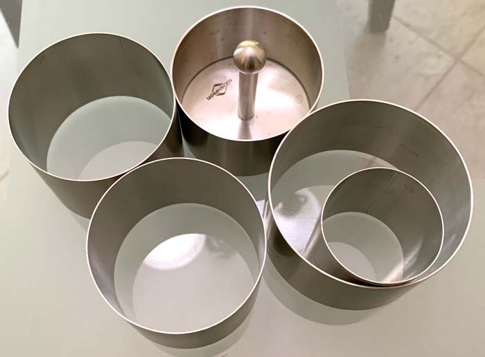 Stainless steel ring molds help you bake and plate beautiful recipes. If you don't have ring molds, you can use ceramic ramekins. 