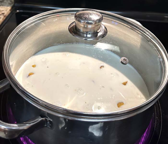 Chestnuts starting to cook - just barely covered with dairy. 