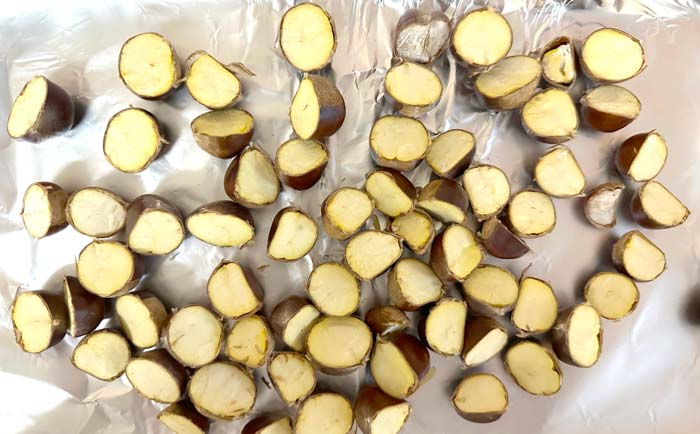 Notice that the chestnuts are placed with the nut meat exposed in order to allow the moisture to escape as they cook.