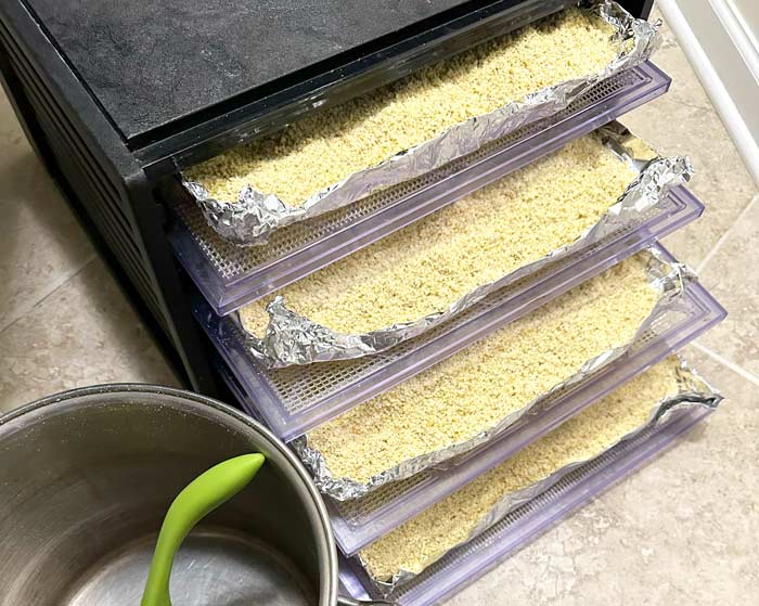 Spoon chestnut flour onto each shelf and spread it evenly to a thickness of about 1/2". Dry for 24 hours on 125°F (52°C).