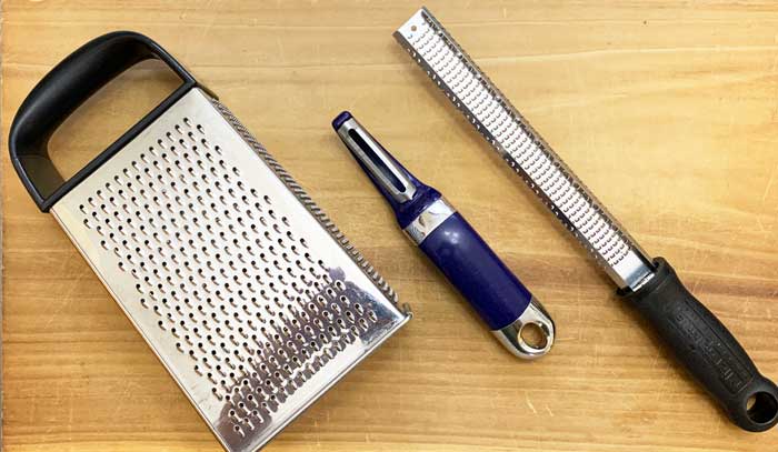 Common kitchen tools that can be used for removing and saving the skin of oranges. Kitchen grater, carrot peeler, and microplane. A microplane is by the best tool for making citrus zest, in our opinion.