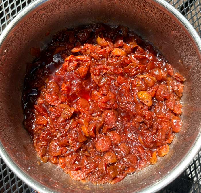 Check out that beautiful red color! This is what our crabapples looked like when they were done cooking but before we pureed them into crabapple butter.