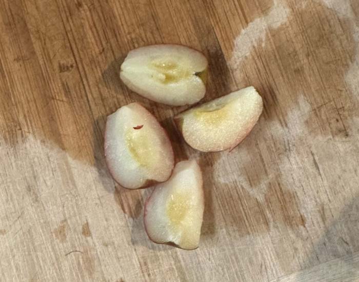 Here's what a finished crabapple should look like once it's quartered and the seeds and calyx are removed. You do NOT need to remove the skins.