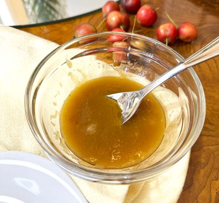 Maple glaze ready to be drizzled on to crabapple hand pies.