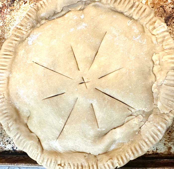 Top crust on and "scored" with a knife. 