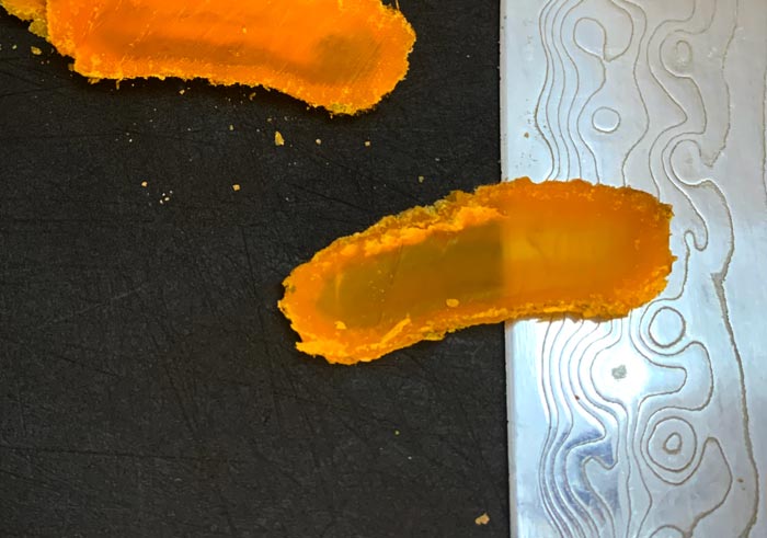 Amber? Nope, a thin-sliced piece of conifer needle/Christmas tree cured egg yolk.