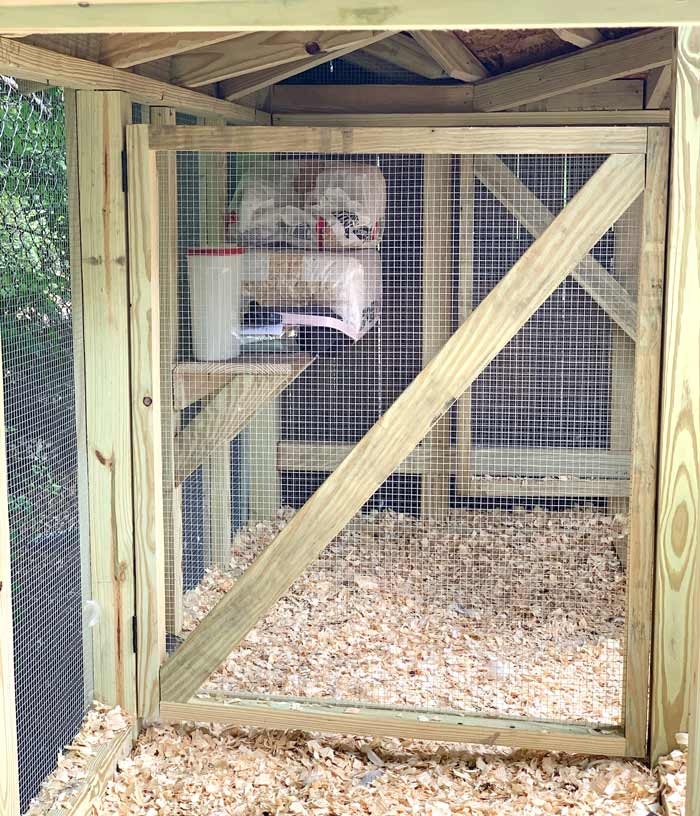 One of the partitions inside our duck coop. If needed, our single duck coop can actually serve as three separate duck coops thanks to these hinged doors which lock with a sliding bolt at the top. 