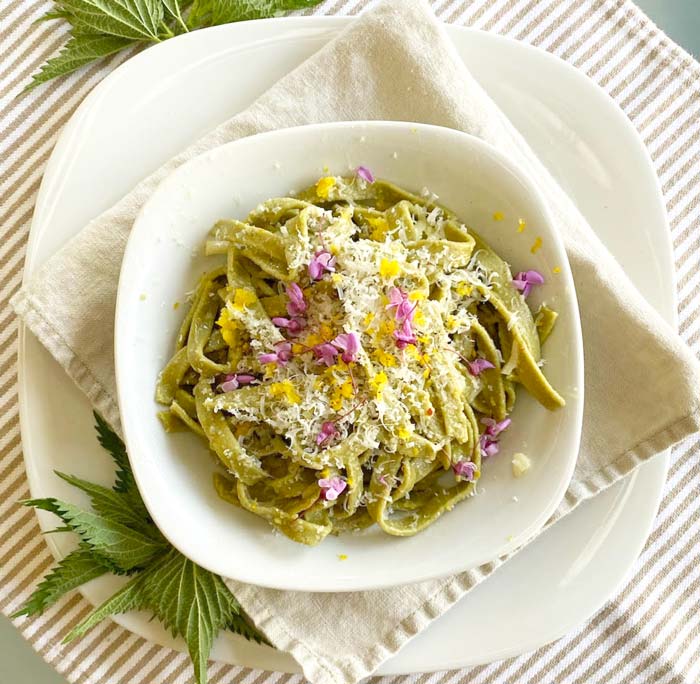 Duck egg stinging nettle pasta, dressed and plated.