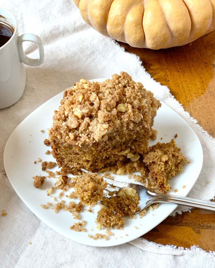 Mmm, fall harvest coffee cake with pumpkins, apples, and walnuts - delicious to the last piece of crumbly goodness.