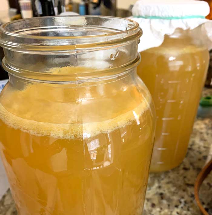 Day 4 of lemonade fermentation and you can see the bubbles forming at the top along with a bit of the pulp that made it through the strainer.