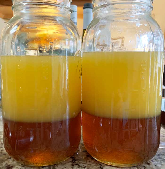 Honey on the bottom, lemon juice in the middle, water about to go on top.