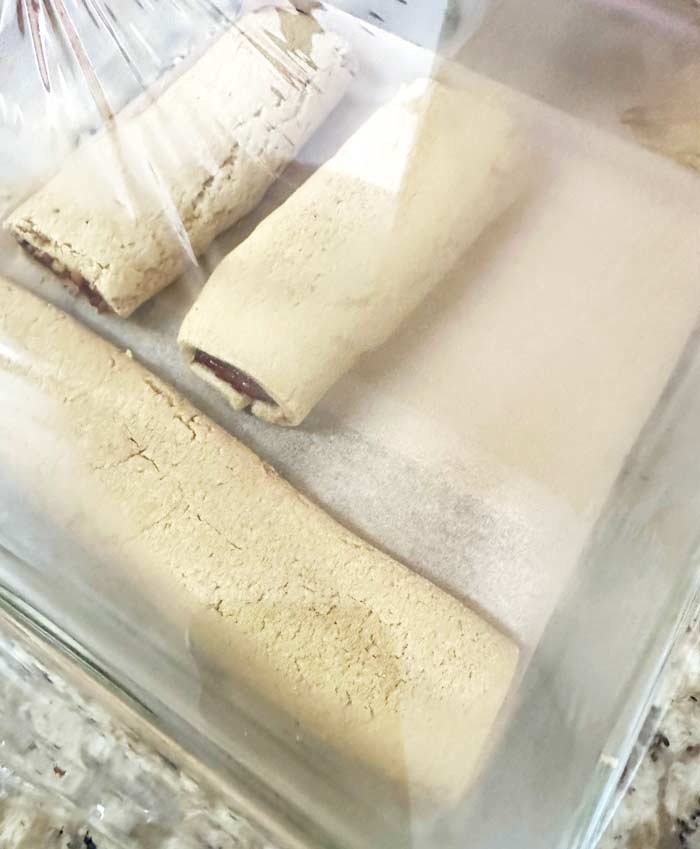 Fig Newton strips steaming in a covered baking dish after removal from oven in order to create a softer, moister Newton. 