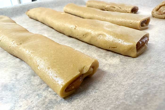 Fig Newton strips on baking sheet, fold-side down.