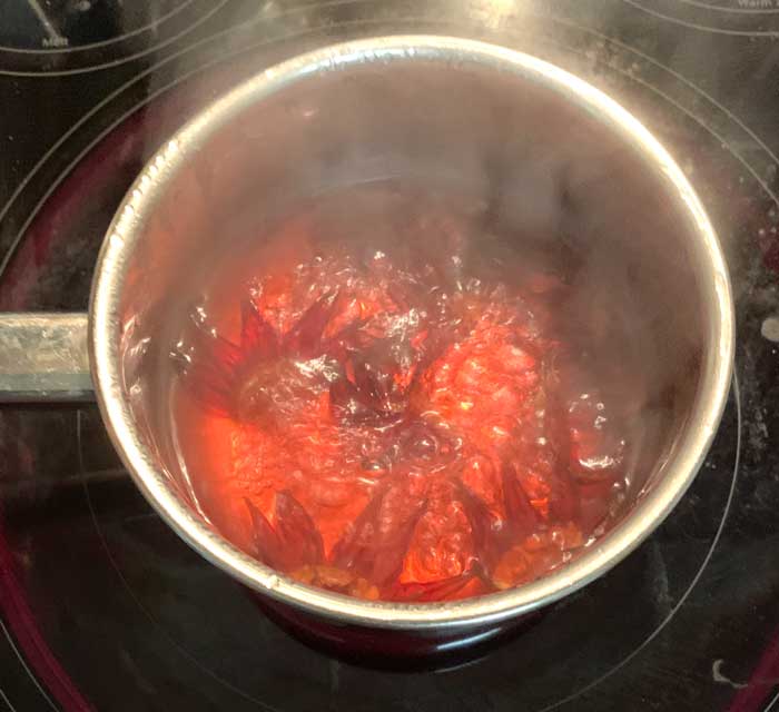 Don't copy this picture. Instead, keep the lid ON while you're making your roselle pickle brine so that you end up with about the same amount of liquid you started with. 