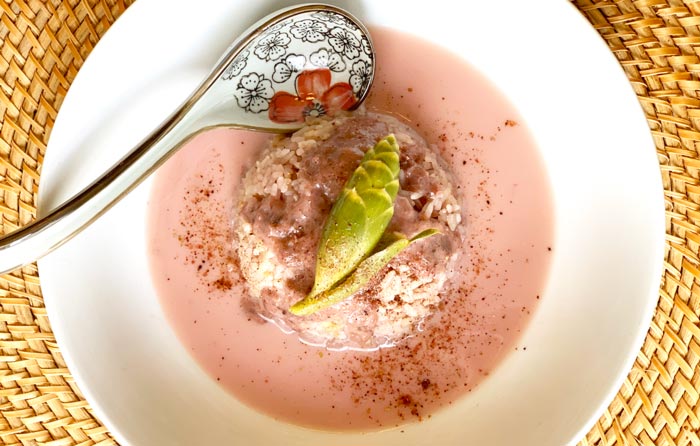 Hibiscus coconut rice dessert made with Hibiscus sabdariffa calyxes, lemongrass, makrut lime leaves, ginger, Carolina Gold rice, and other ingredients.