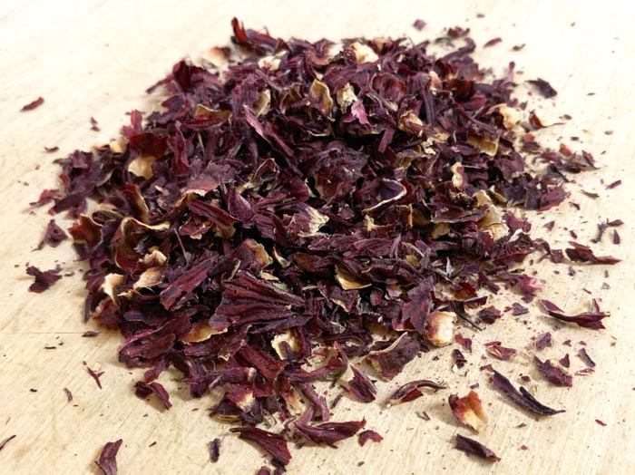 Dried roselles broken into smaller pieces.