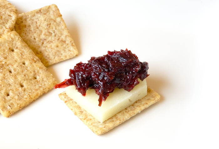 Hibiscus relish on cheese and crackers.