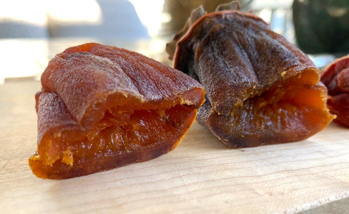 A young hoshigaki made from a Hachiya persimmon, still gooey in the middle. When you make your own, you can also eat some along the way and take notes. That way, you can pinpoint exactly how long you want to age your hoshigaki based on your personal preferences when you make it in the future.