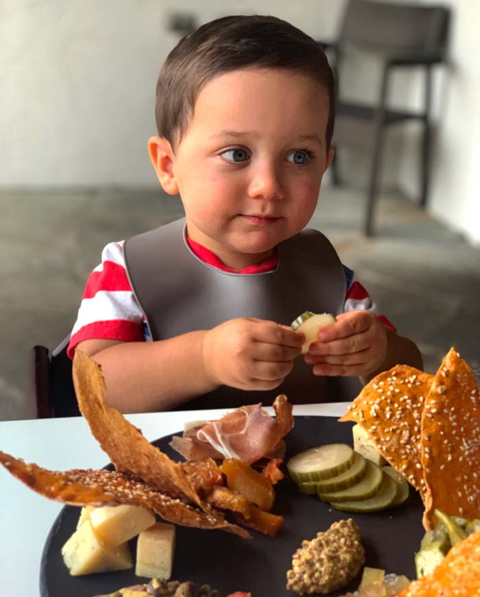 Sebastian's first meal out at around 21 months old. Here, he's enjoying a charcuterie board with his family. It's REALLY nice not having a picky eater when you're at a restaurant. 