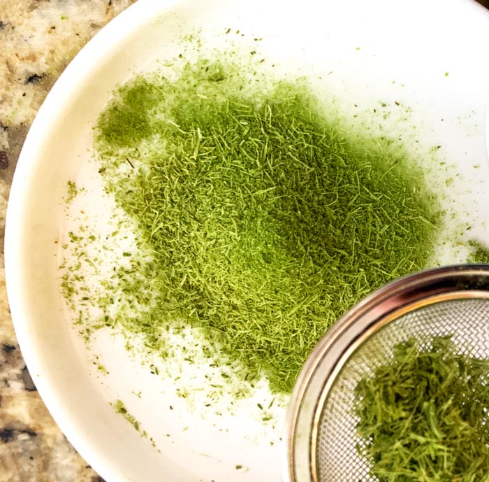Dried, month-old blue spruce needles pulverized in a spice grinder and sifted to produce spruce powder, a wonderful flavoring/spice.