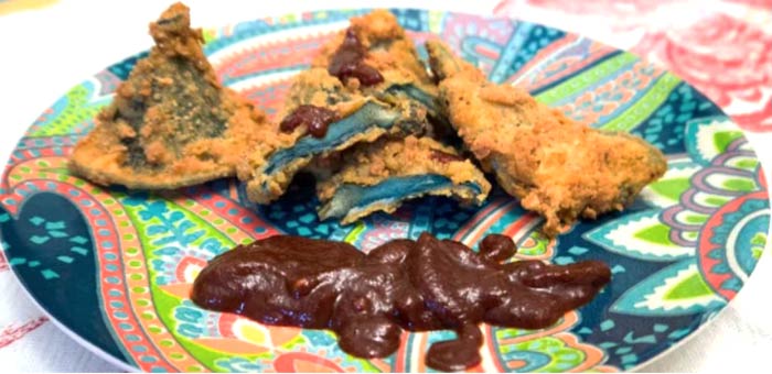 Indigo milk caps fried and ready to dip into some homemade heirloom tomato-based bbq sauce. Fried indigo milk cap mushroom recipe.