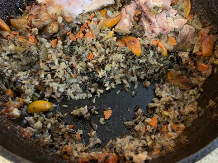 A closer look at the consistency of the cooked rice in this recipe (and our half-finished pot). 