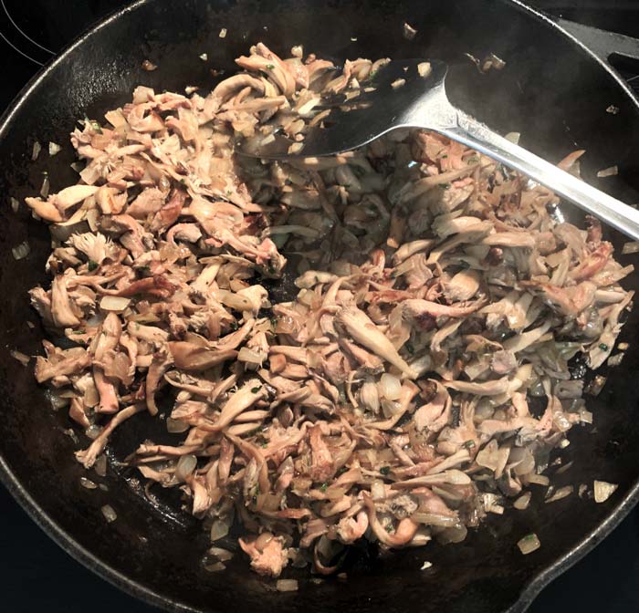 Lion's mane mushrooms, onion, thyme, garlic, pinch of salt. Almost done and ready to deglaze the pan with a splash of white wine!