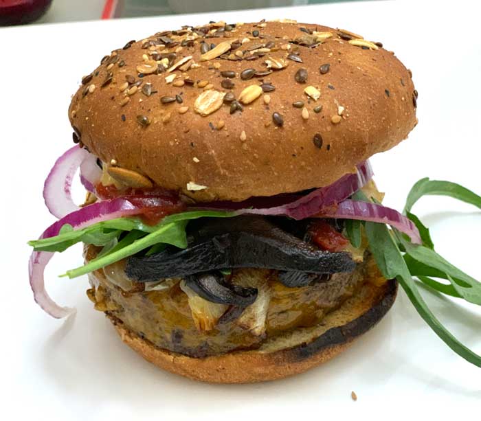 The Tyrant's burger topped with cooked, corrugated milk cap mushrooms.