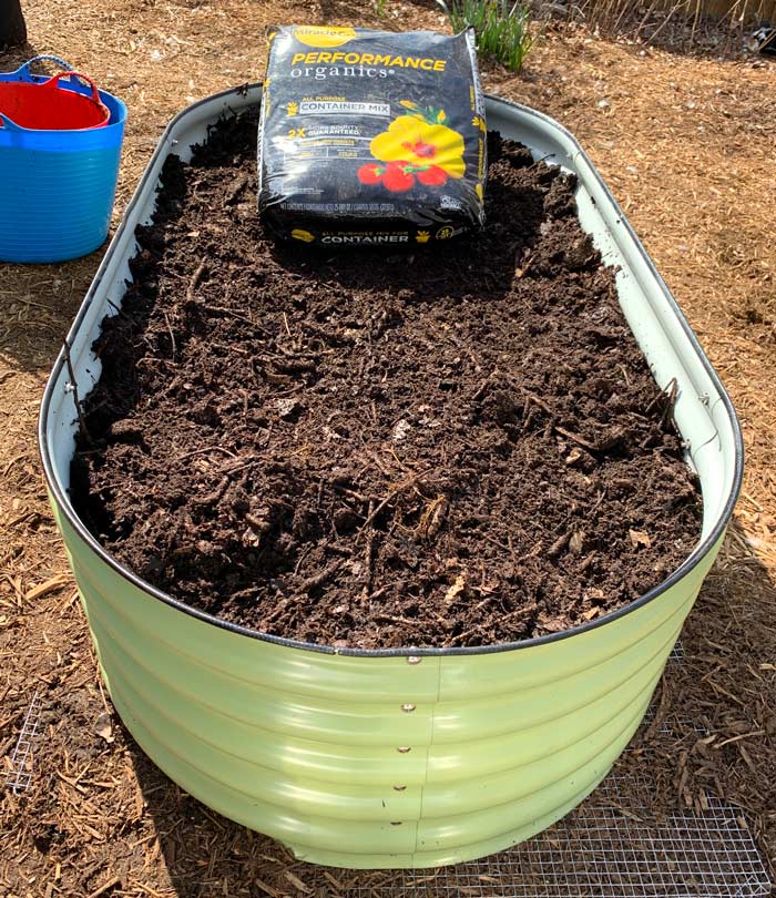 Organic container mix for the seed bed. 1-2 bags can easily provide what you need here, but you can also use finish compost or worm castings if you have enough available.