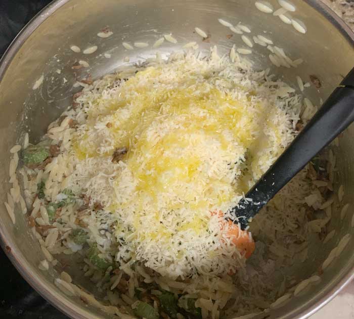 Almost done! Adding fresh-grated parmesan cheese and a bit more olive oil.