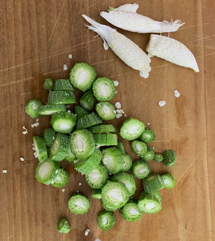 Immature Common milkweed pods. Small tender ones are chopped. Larger slightly older ones are best used by removing the fibrous outer skin and removing the juicy white immature seed and silk inside.