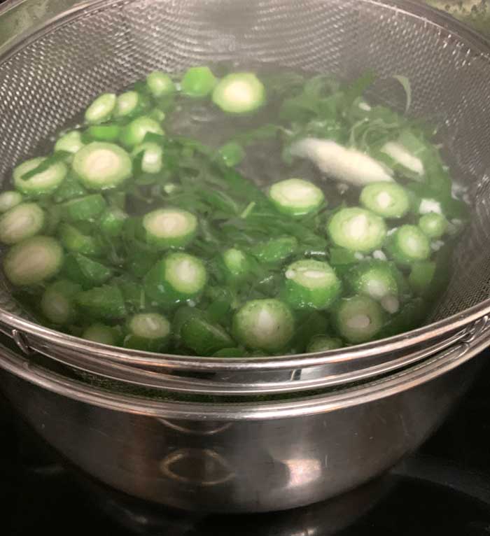 Common milkweed parts being flash boiled for one minute.