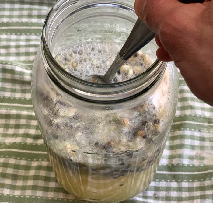 Make sure to stir your fermenting passion fruit cordial at least twice each day until you strain, bottle, and refrigerate it.