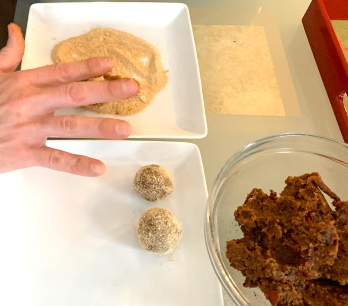 Form badder into balls then roll it in the maple sugar-salt mixture before adding each finished ball to a serving plate. 
