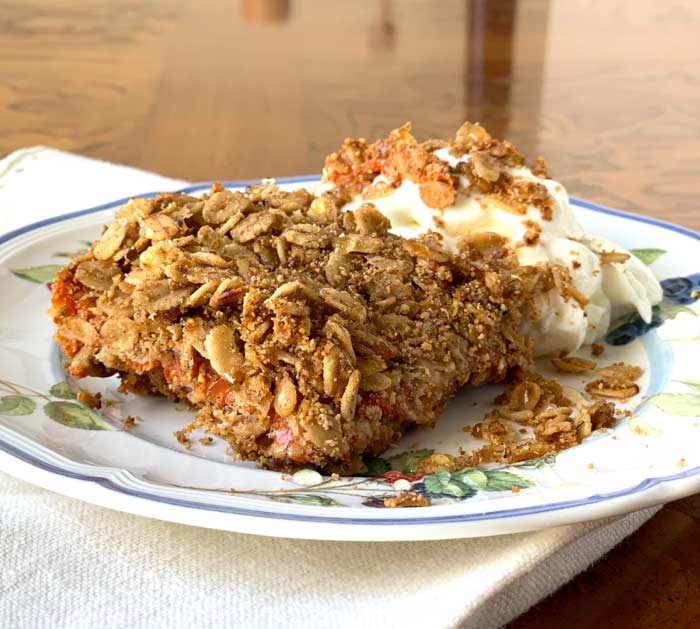Tyrant Farms' gluten-free persimmon oat crumble drizzled with backyard honey and served with a side of yogurt. 