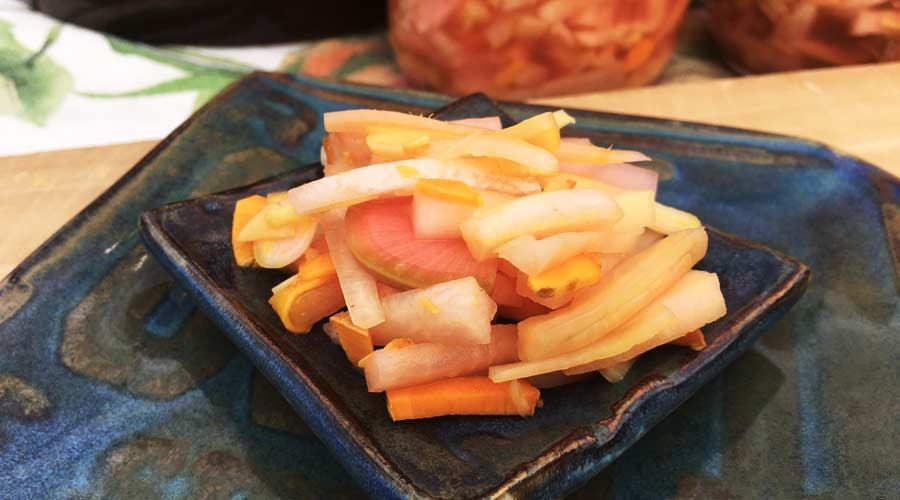 Mmm. Lacto-fermented pickled daikon radishes with blue ginger and orange turmeric.