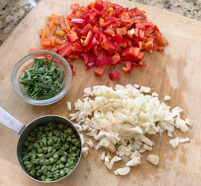 From the garden: tender young garlic chive seeds, diced hardneck garlic, rosemary, sweet red peppers.