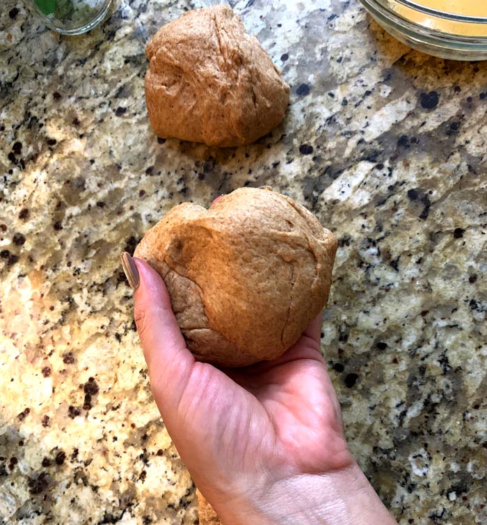 The dough for each poğaça should be a little bigger than a baseball. You'll want to separate the dough into individual balls before proceeding.