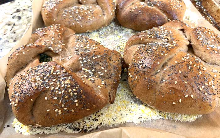 Round 2 poğaças from our wood-fired cob oven: baked to golden perfection!